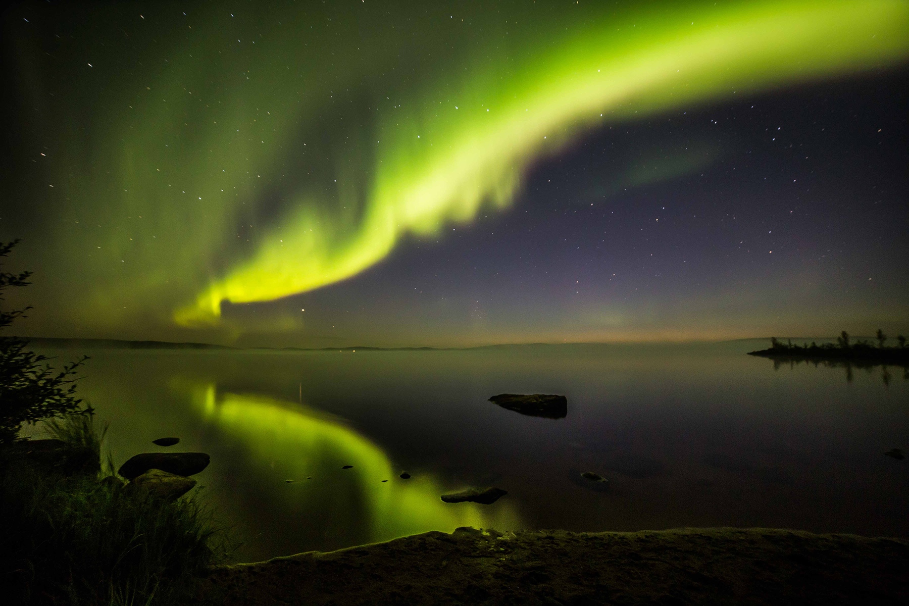 Northern lights reflected from the lake