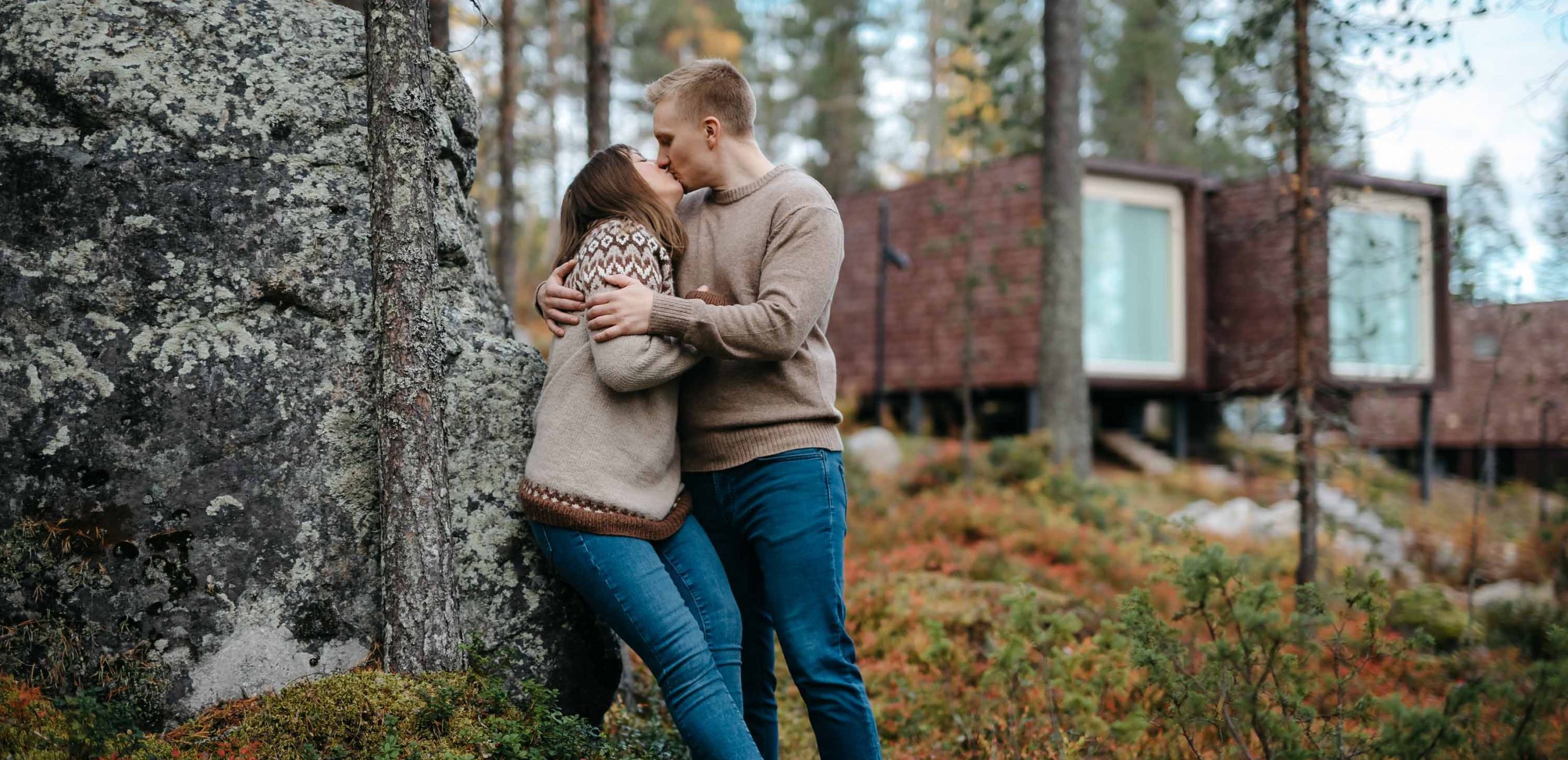 Couple kissing outdoors during autumn