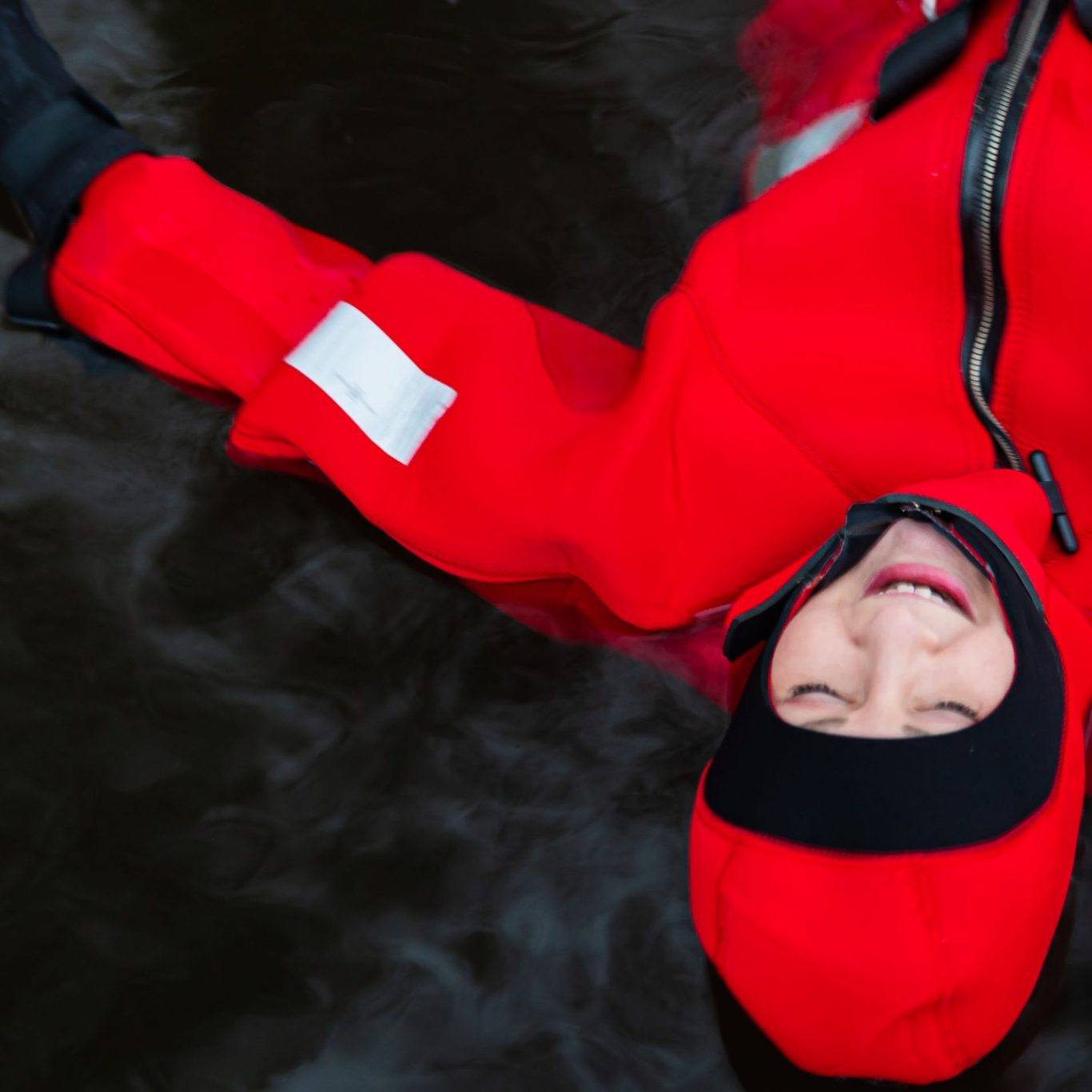 A woman floating in a thermal suite in Lapland
