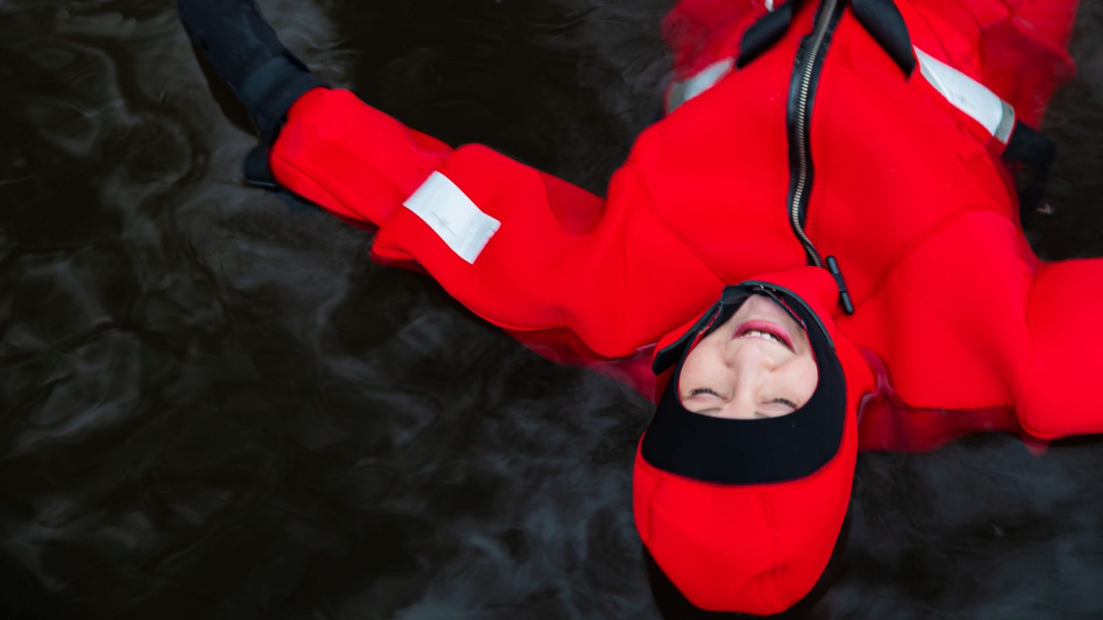 A woman floating in a thermal suite in Lapland