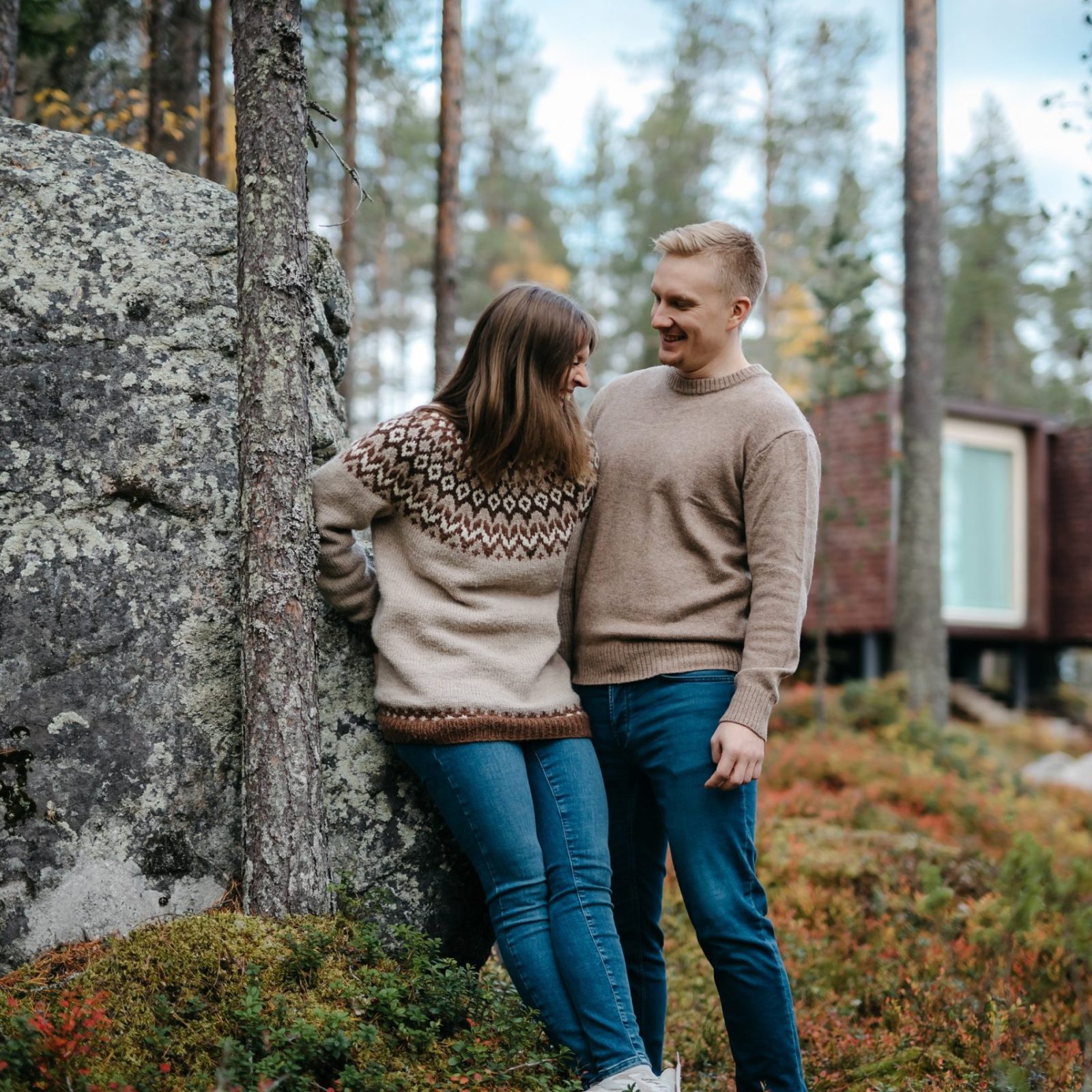 Couple enjoying autumn in Arctic TreeHouse Hotel Rovaniemi Finland.