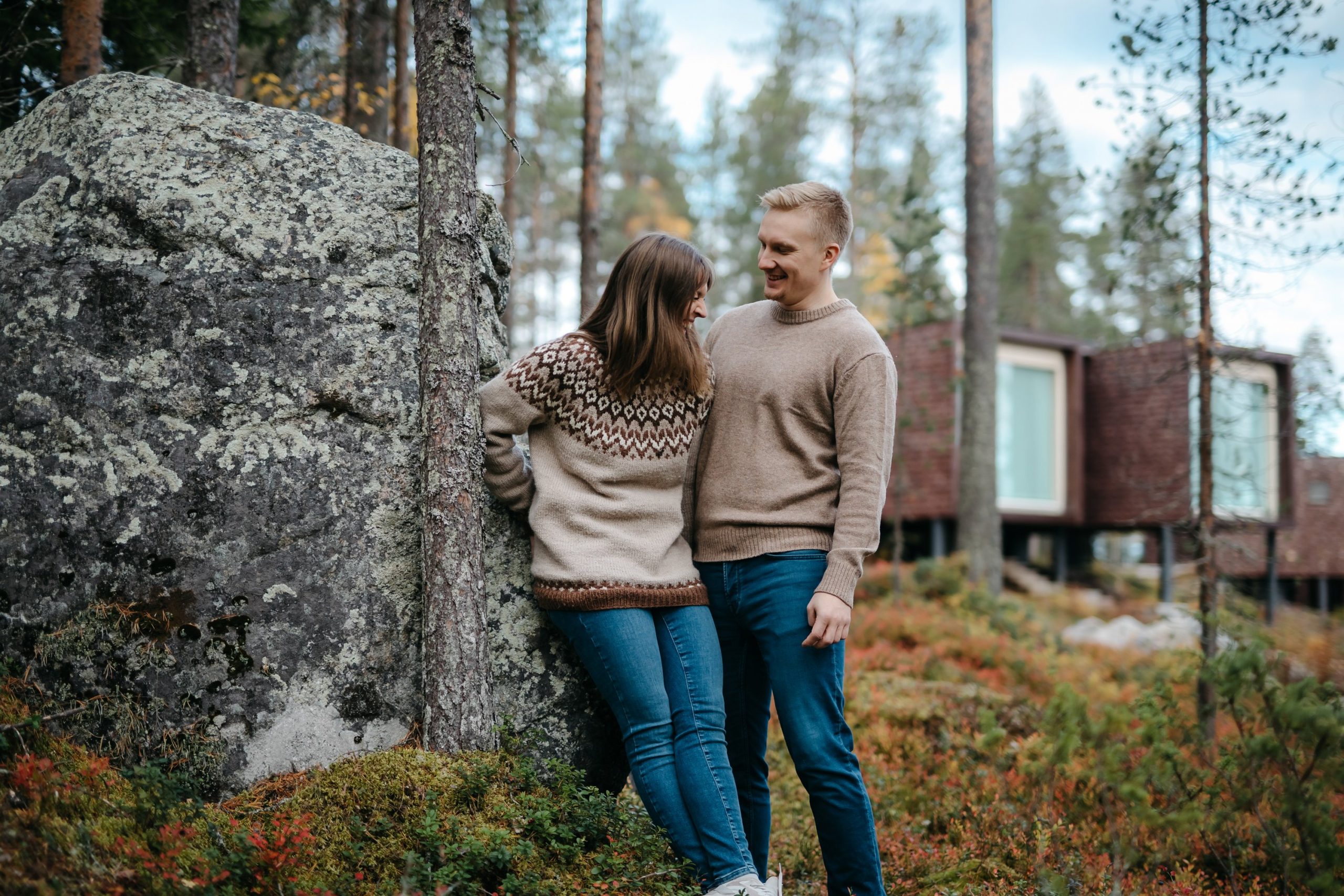 Couple enjoying autumn in Arctic TreeHouse Hotel Rovaniemi Finland.