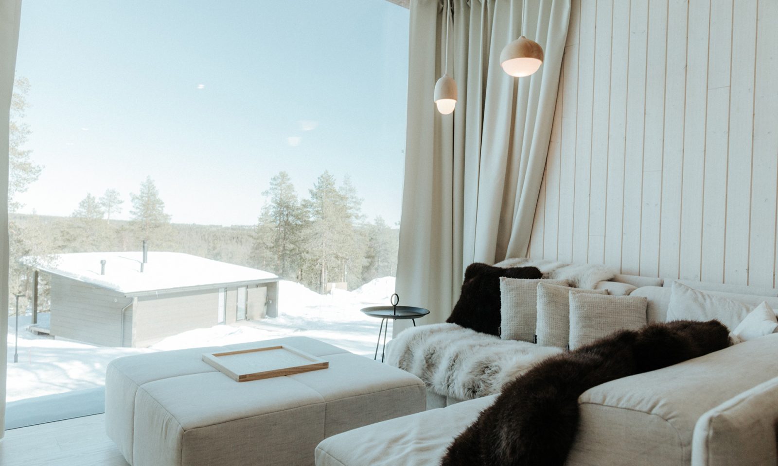 Arctic Scene Executive Suites Lounge Area and panoramic window.