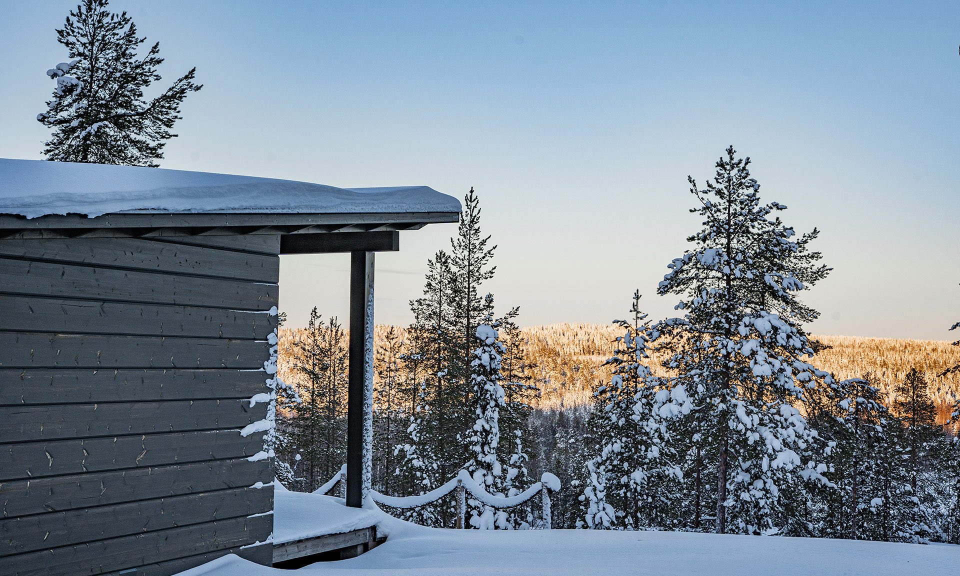 Arctic Glass House snowy terrace in the Arctic TreeHouse Hotel.