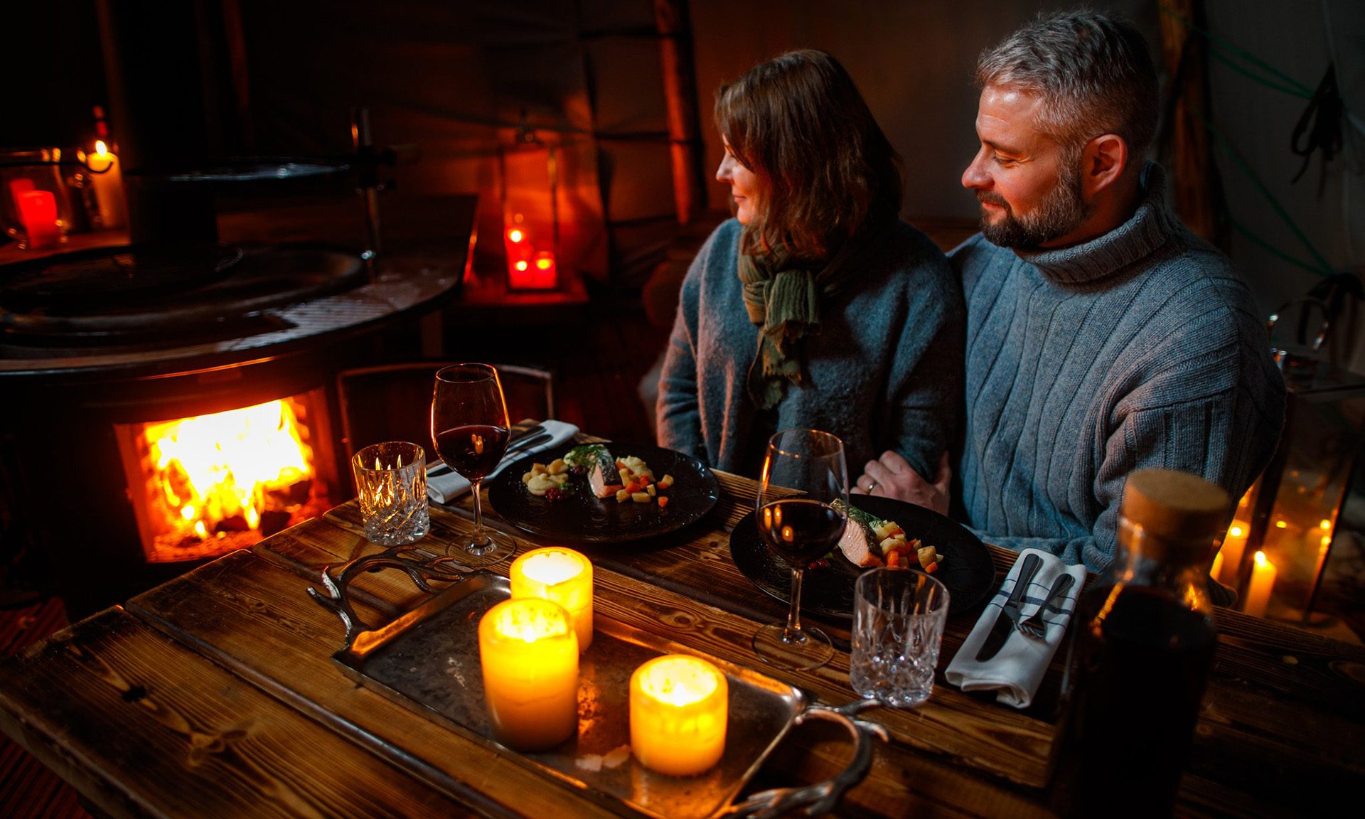Couple enjoying private dining at the Arctic TreeHouse Hotel.