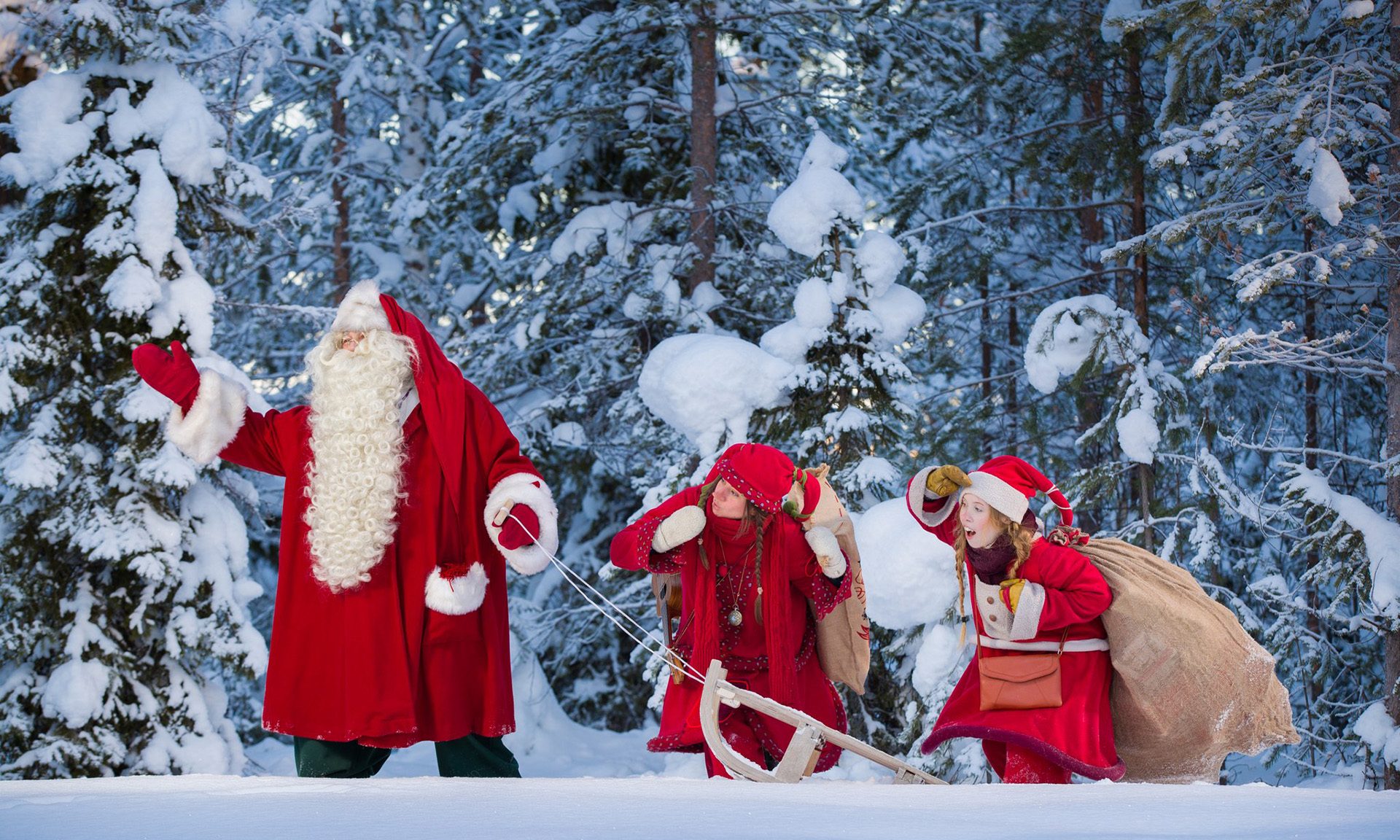 Santa Claus and Elves carrying presents in Santa Claus Secret Forest Joulukka.