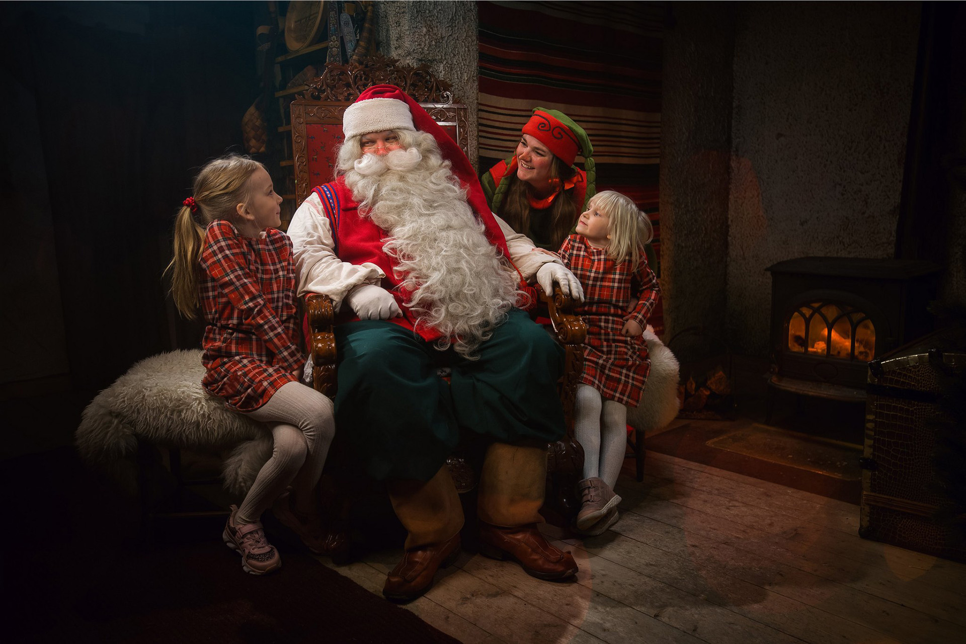 Santa Claus, Elf and kids at the command centre of Santa Claus Secret Forest Joulukka.