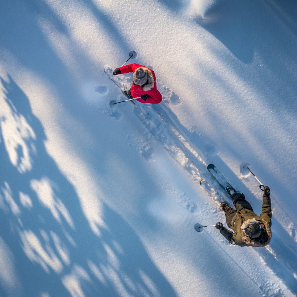 Couple enjoying complimentary activities at the Arctic TreeHouse Hotel. | Rovaniemi