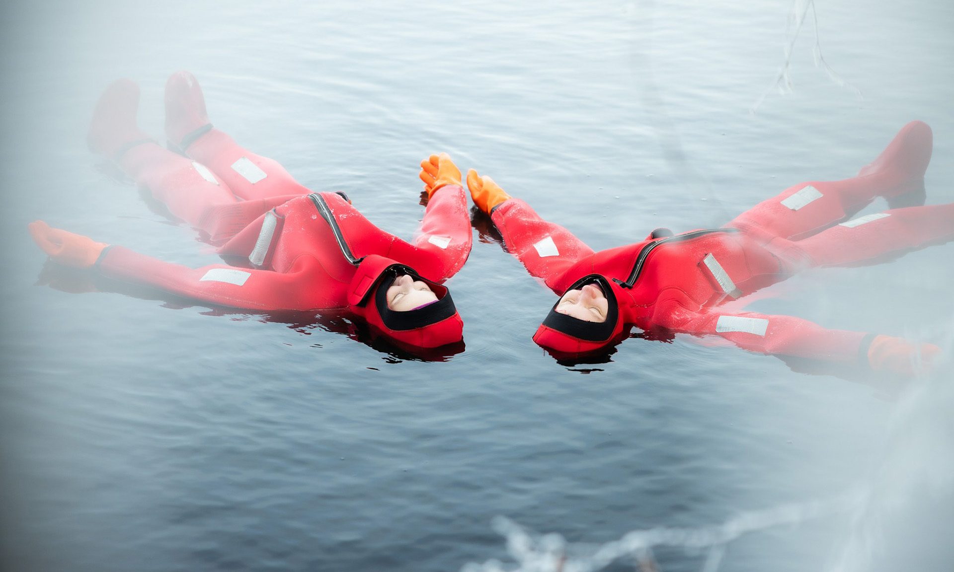 Friends relaxing in Arctic floating activity in spring. | Arctic TreeHouse Hotel, Rovaniemi