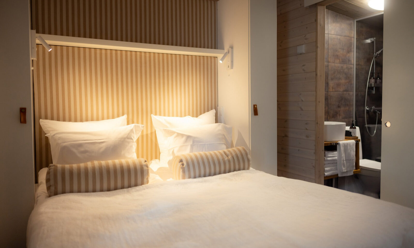 Double bed in the bedroom of the Arctic GlassHouse. | Arctic TreeHouse Hotel