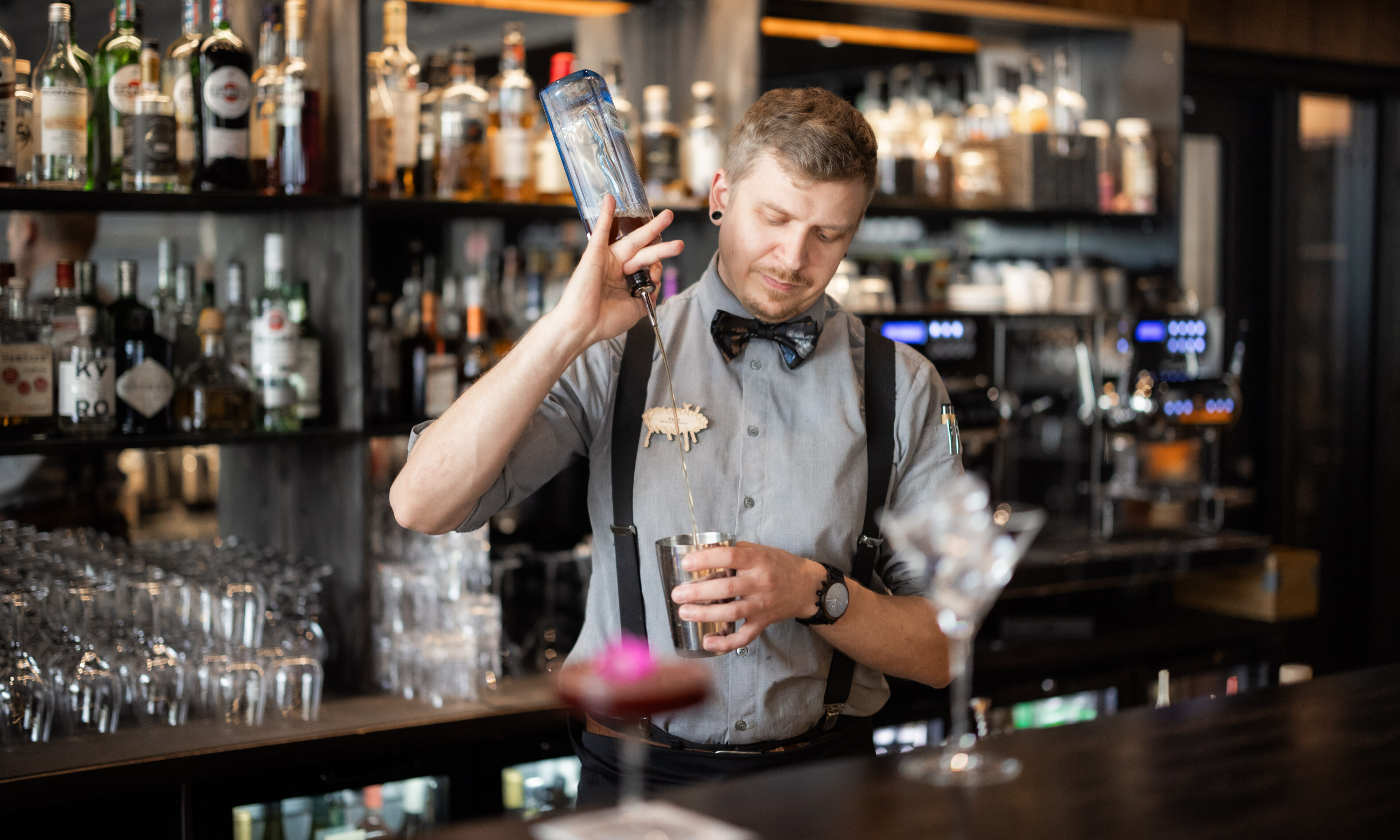 Bartender making a cocktail at Rakas Restaurant & Bar.. Rovaniemi, Lapland.